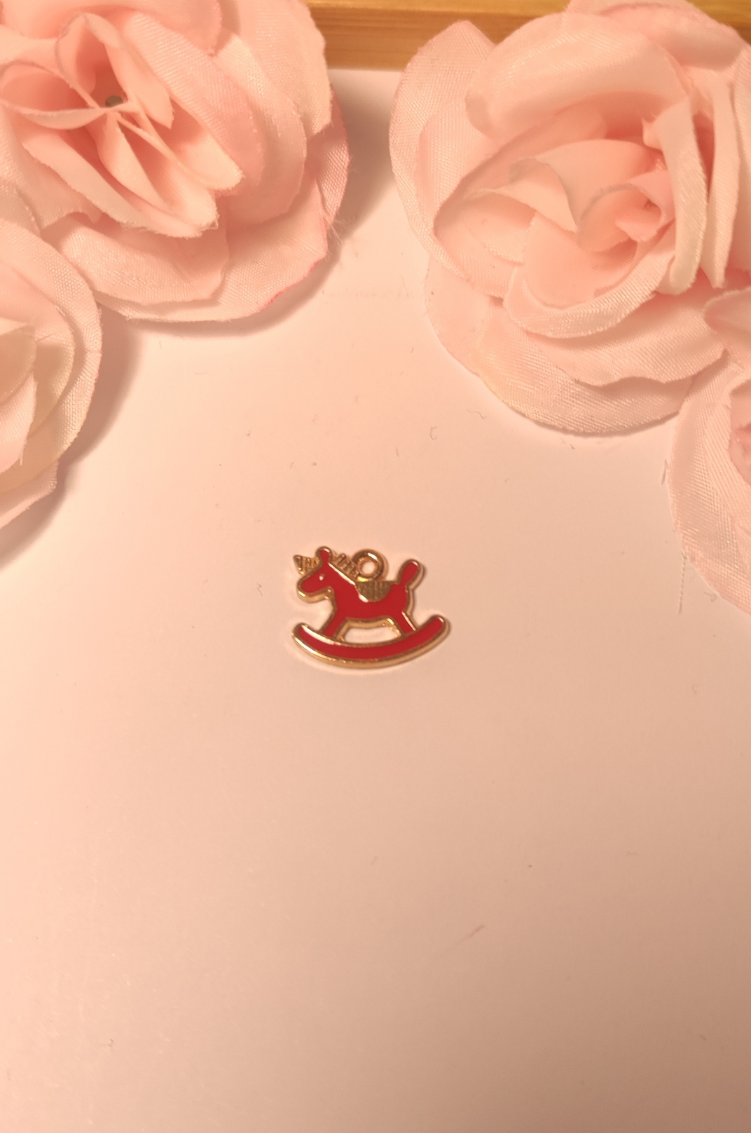 Charms cheval à bascule