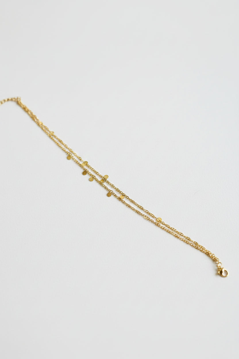 Détail chaîne de cheville double chaîne mini pampilles dorées acier inoxydable – Rêve de Rose