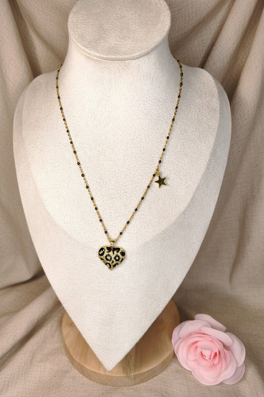 Collier chaîne doré et noire avec un gros cœur noir et doré au motif léopard et un petit pendentif étoile dorée - Rêve de Rose